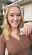 Happy student holding a driver’s license